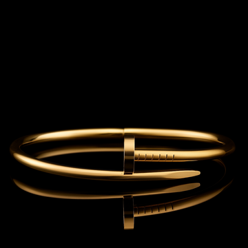 Gold bracelet on a black background