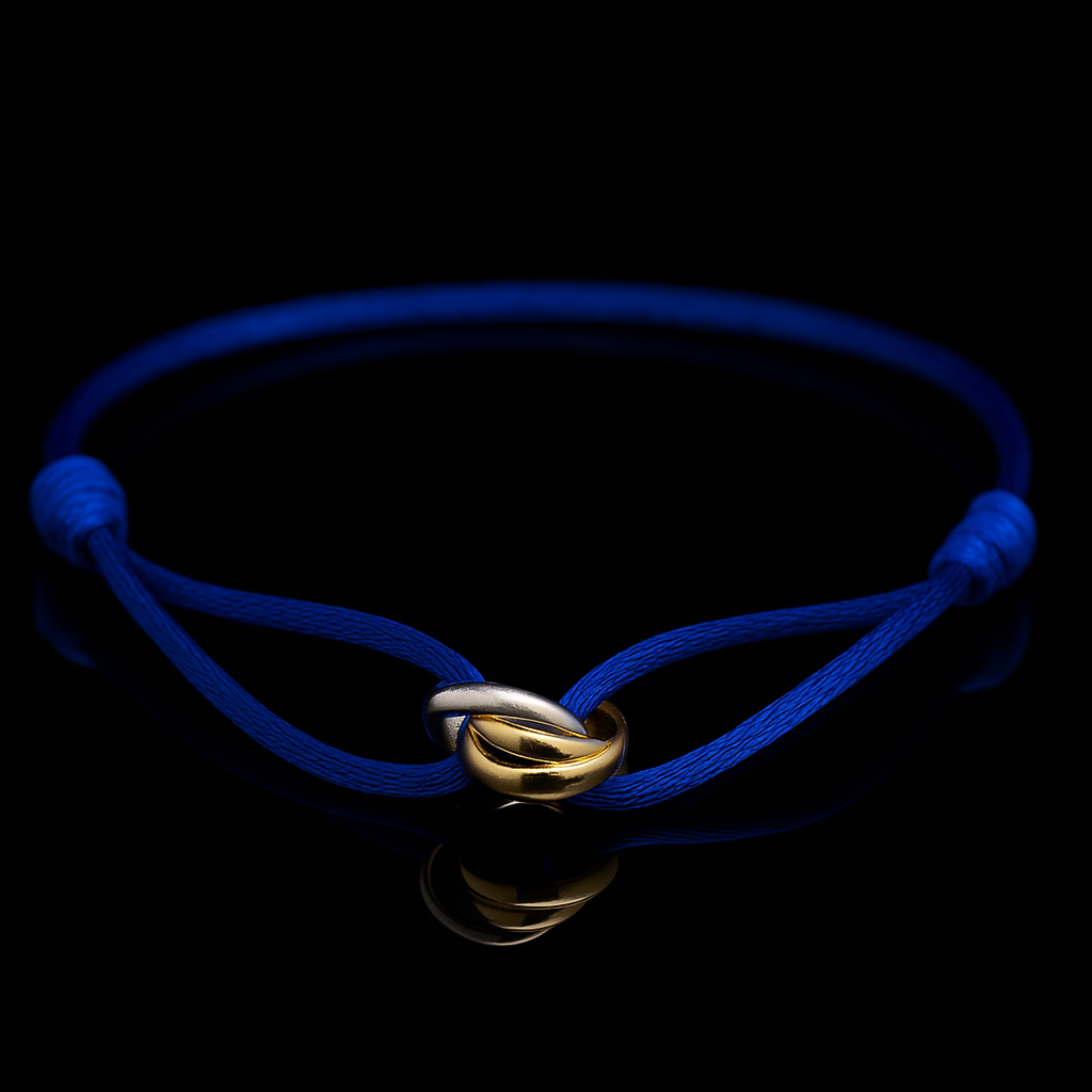 Blue bracelet with a gold clasp on a black background