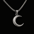 Silver crescent moon necklace on a black background